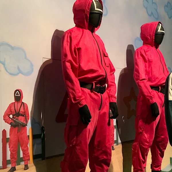 pink boiler suits from the Squid Game South Korean TV programme shown at the V&A Korean Wave exhibition London
